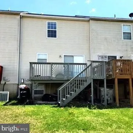 Rent this 3 bed townhouse on 12090 Calico Woods Place in Holly Tree Park, Waldorf