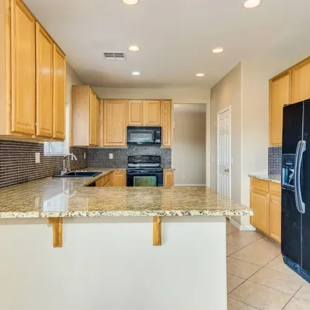 Rent this 5 bed apartment on 15548 North 174th Lane in Surprise, AZ 85388