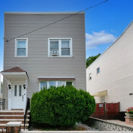 Buy this 3 bed house on 71-30 72nd Place in New York, NY 11385