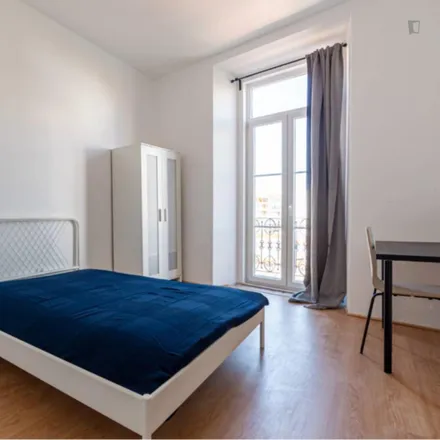 Rent this 9 bed room on Estrada de Benfica 628 in 1500-107 Lisbon, Portugal