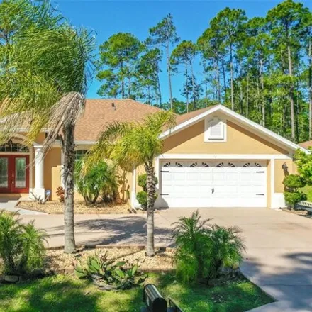 Buy this 4 bed house on 38 Red Top Lane in Palm Coast, FL 32164
