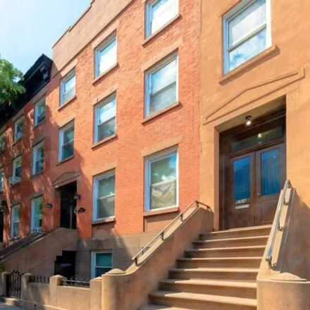 Buy this 4 bed townhouse on 556 Henry Street in New York, NY 11231
