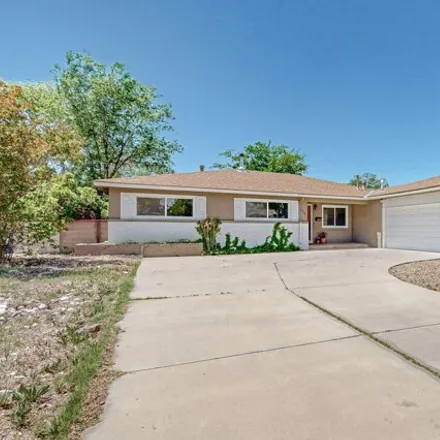 Buy this 3 bed house on 1461 Valencia Drive Northeast in Albuquerque, NM 87110