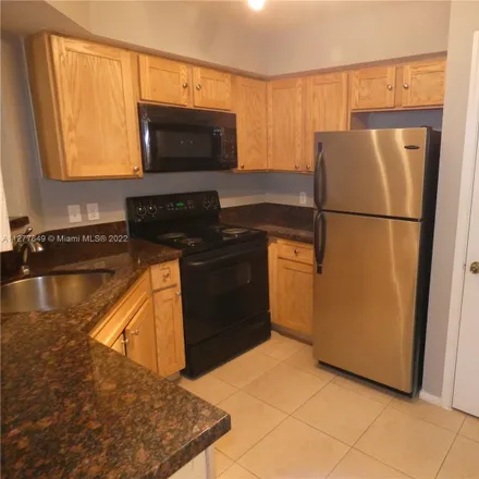 Buy this 2 bed condo on 2438 Northwest 33rd Street in Royal Palm Isles, Broward County