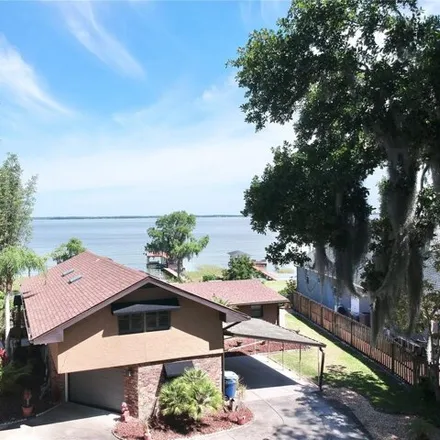 Buy this 4 bed house on 175 Banning Beach Road in Tavares, FL 32778