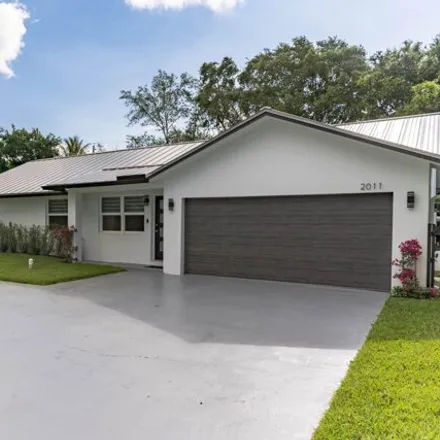 Rent this 3 bed house on 221 North Seacrest Circle in Delray Beach, FL 33444