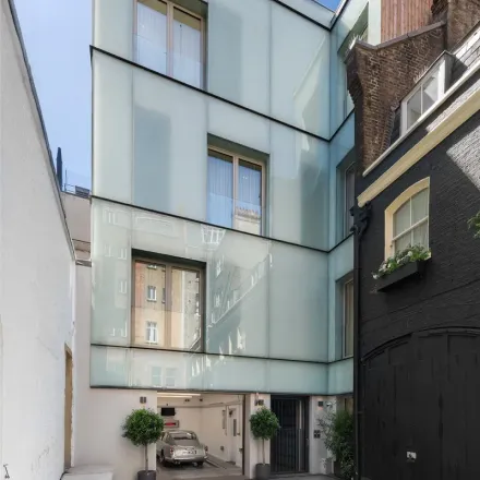 Rent this 4 bed townhouse on 1 Down Street Mews in London, W1J 7AU