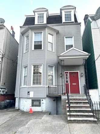 Buy this 7 bed house on 141 Hutton Street in Jersey City, NJ 07307