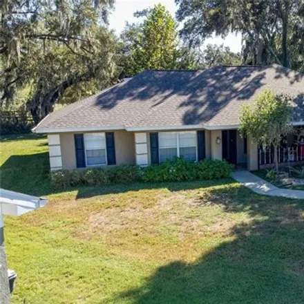Buy this 4 bed house on 1401 Ashbury Court in Polk County, FL 33809