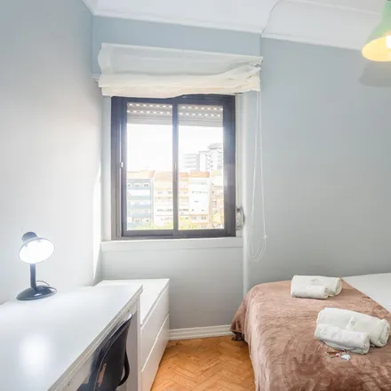 Rent this 4 bed room on Avenida São João de Deus in 1000-009 Lisbon, Portugal