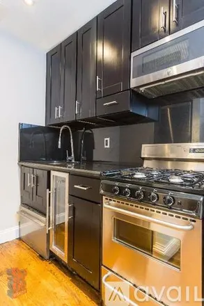 Rent this 4 bed apartment on 420 W 51 St