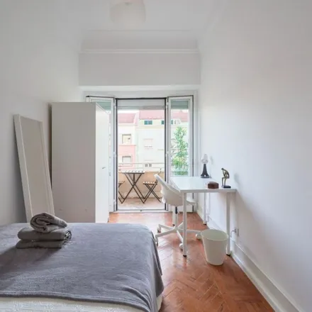 Rent this 12 bed apartment on Avenida Almirante Reis 219 in 1900-183 Lisbon, Portugal