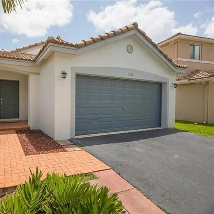 Buy this 3 bed house on 1297 Sago Lane in Weston, FL 33327