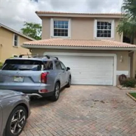 Rent this 4 bed house on 7806 NW 60th Ln