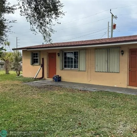 Rent this 3 bed house on Florida Palms Academy in McKinley Street, Sunshine Park