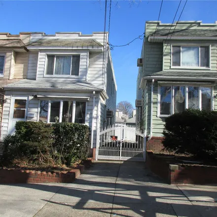 Buy this 3 bed townhouse on 77-11 64th Lane in New York, NY 11385