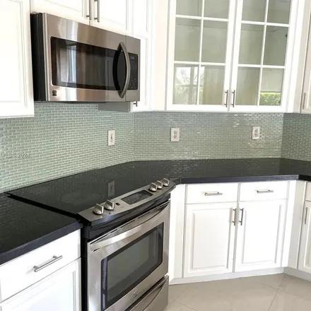 Rent this 3 bed apartment on 5877 Northwest 108th Place in Doral, FL 33178